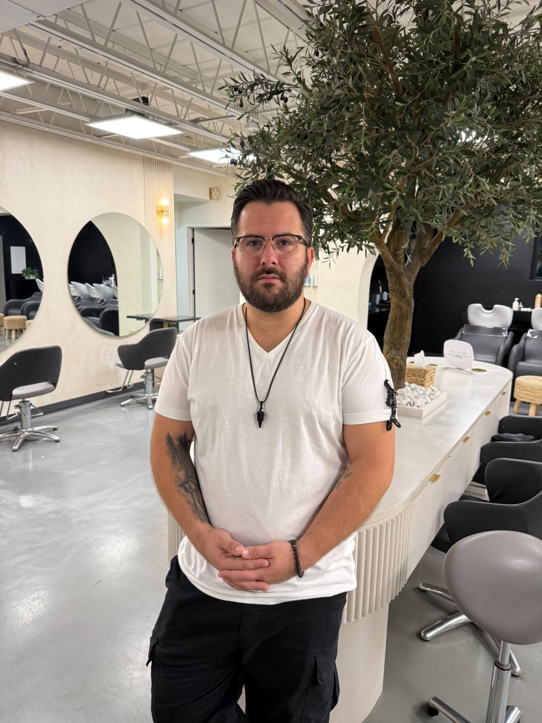 Christopher Luis standing in the salon